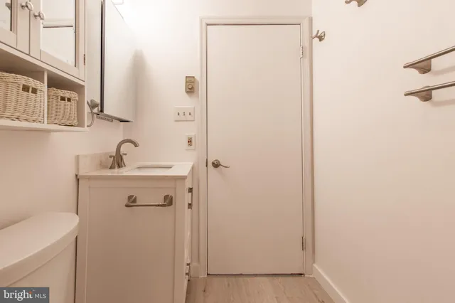 a bathroom with a sink and mirror