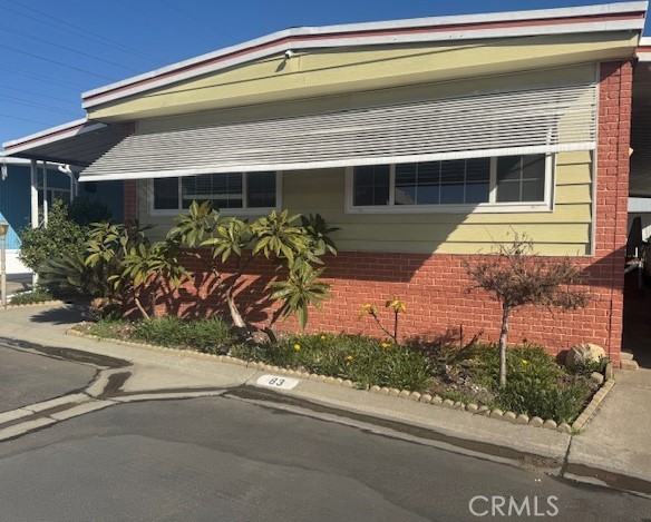 11250 Beach Boulevard, Unit 83 Stanton, CA 90680 - Photo 1 of 5 a front view of a house with garden