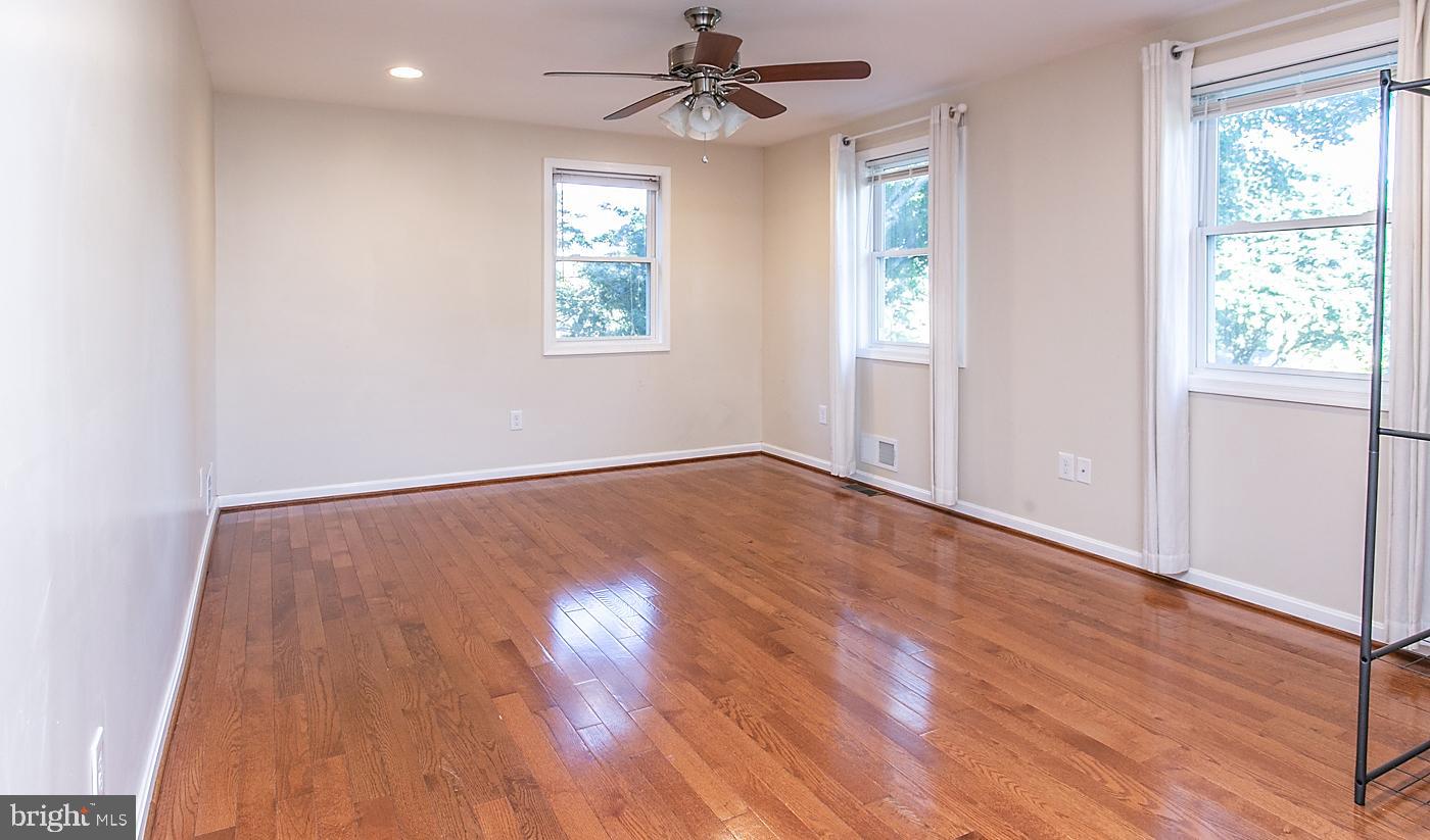288 Devonshire Road Devon, PA 19333 - Photo 21 of 48 wooden floor in an empty room with a window