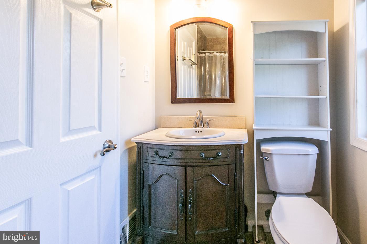 288 Devonshire Road Devon, PA 19333 - Photo 24 of 48 a bathroom with a toilet sink and mirror