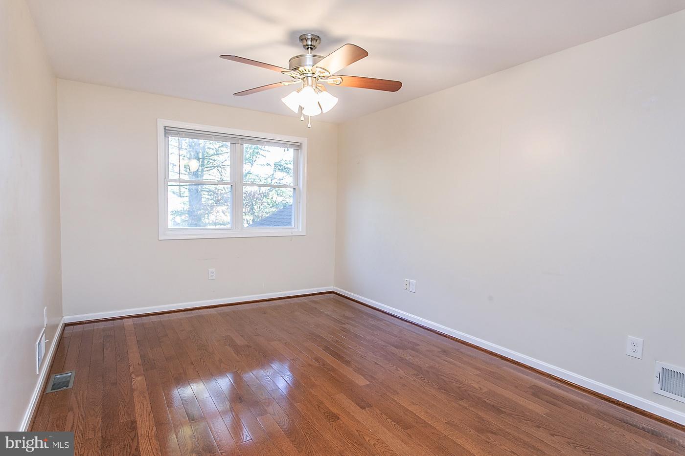 288 Devonshire Road Devon, PA 19333 - Photo 26 of 48 an empty room with wooden floor and windows