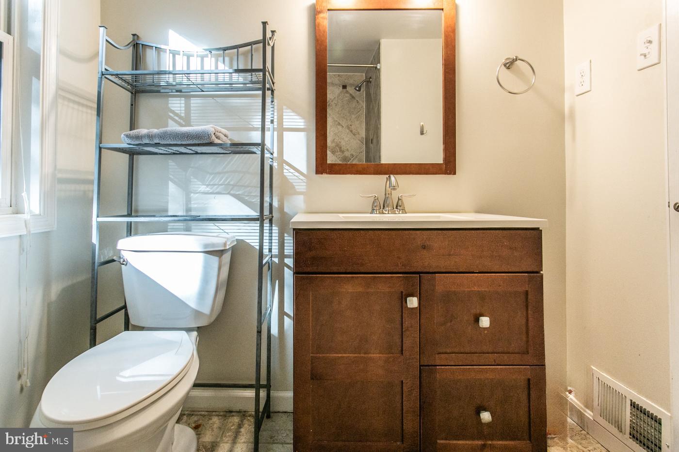 288 Devonshire Road Devon, PA 19333 - Photo 28 of 48 a bathroom with a toilet sink and mirror