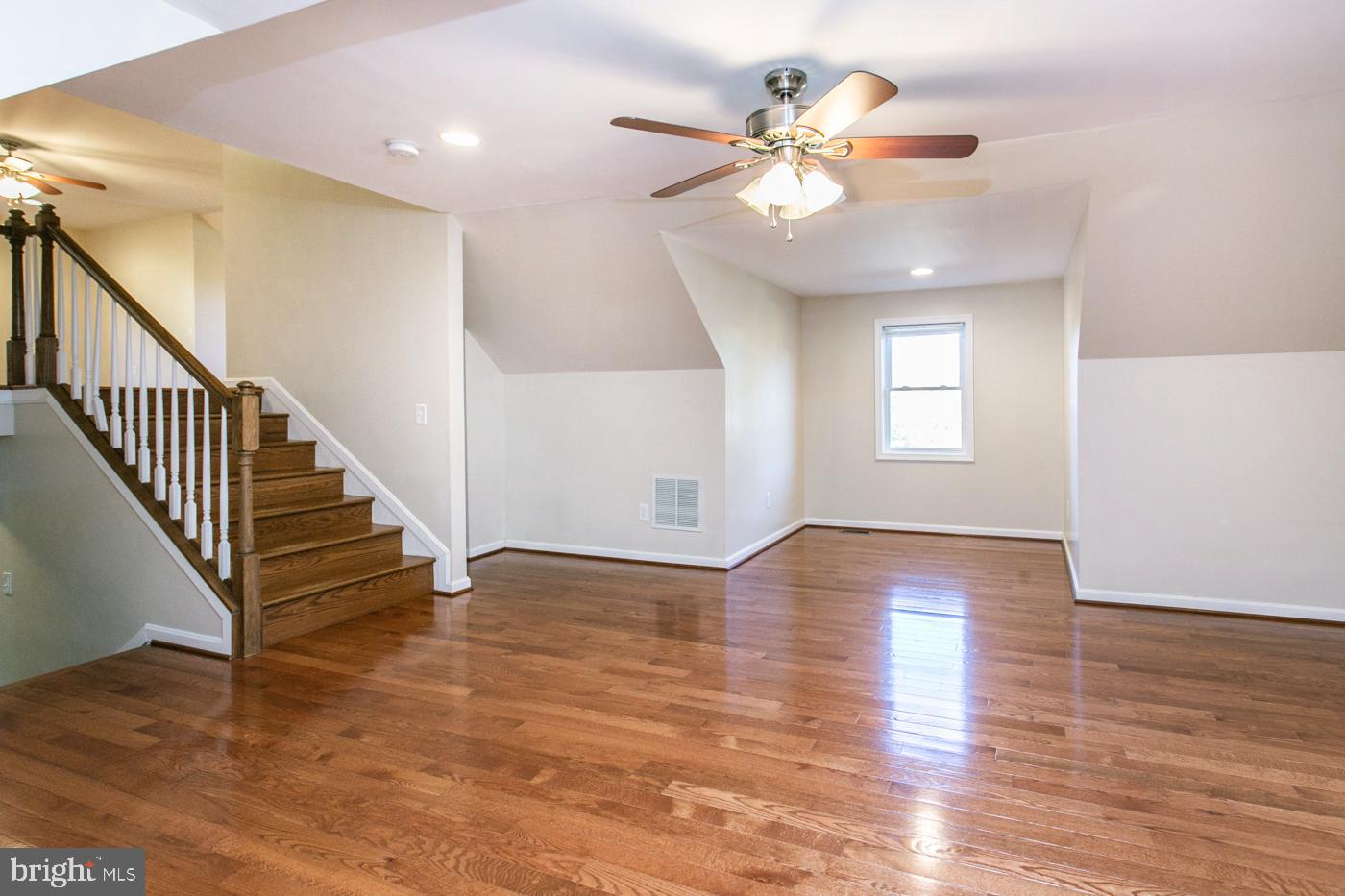 288 Devonshire Road Devon, PA 19333 - Photo 31 of 48 a view of an empty room with wooden floor and a chandelier