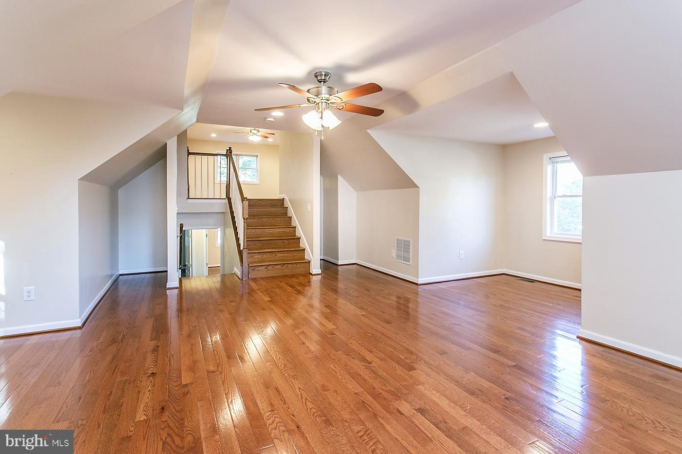 288 Devonshire Road Devon, PA 19333 - Photo 32 of 48 a view of an empty room with wooden floor and a ceiling fan