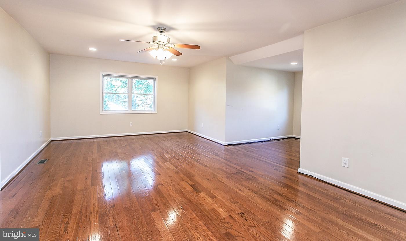 288 Devonshire Road Devon, PA 19333 - Photo 33 of 48 an empty room with wooden floor and windows