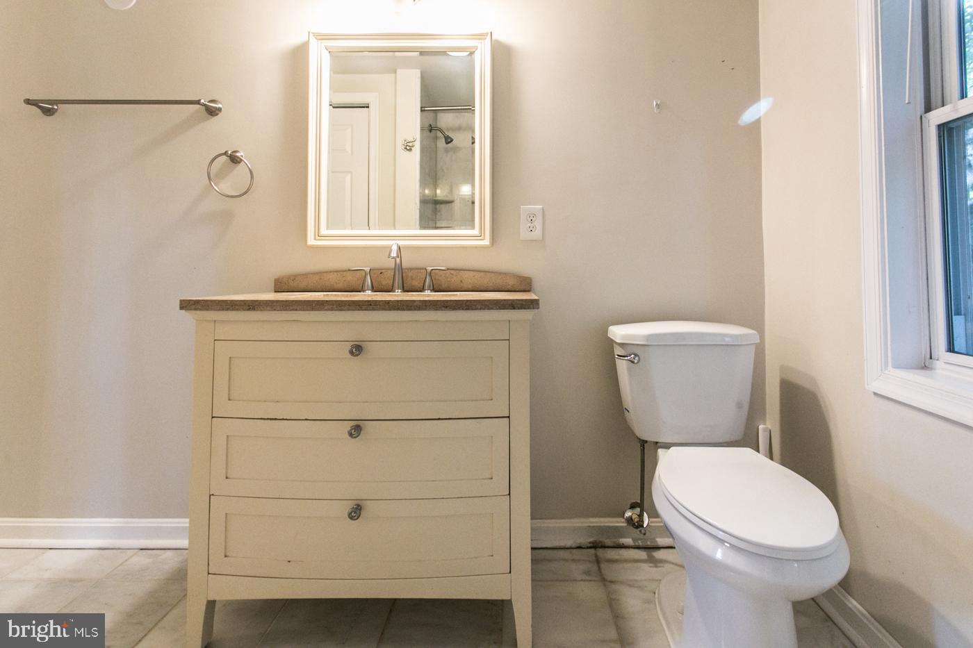 288 Devonshire Road Devon, PA 19333 - Photo 36 of 48 a bathroom with a toilet a sink a vanity and mirror
