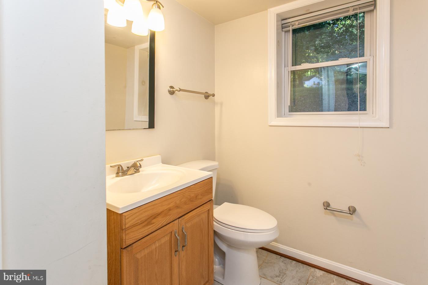 288 Devonshire Road Devon, PA 19333 - Photo 41 of 48 a bathroom with a toilet a sink and a mirror