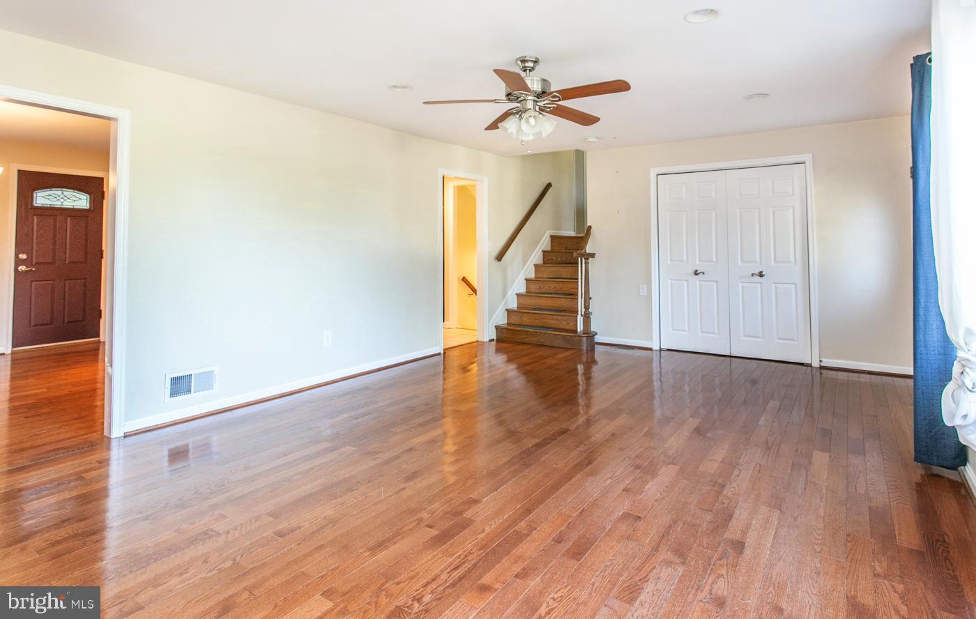 288 Devonshire Road Devon, PA 19333 - Photo 8 of 48 a view of a hallway with wooden floor and a ceiling fan