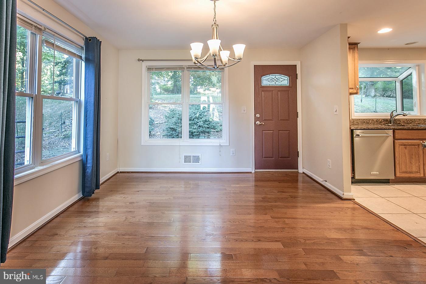 288 Devonshire Road Devon, PA 19333 - Photo 10 of 48 a view of an empty room with wooden floor and a window