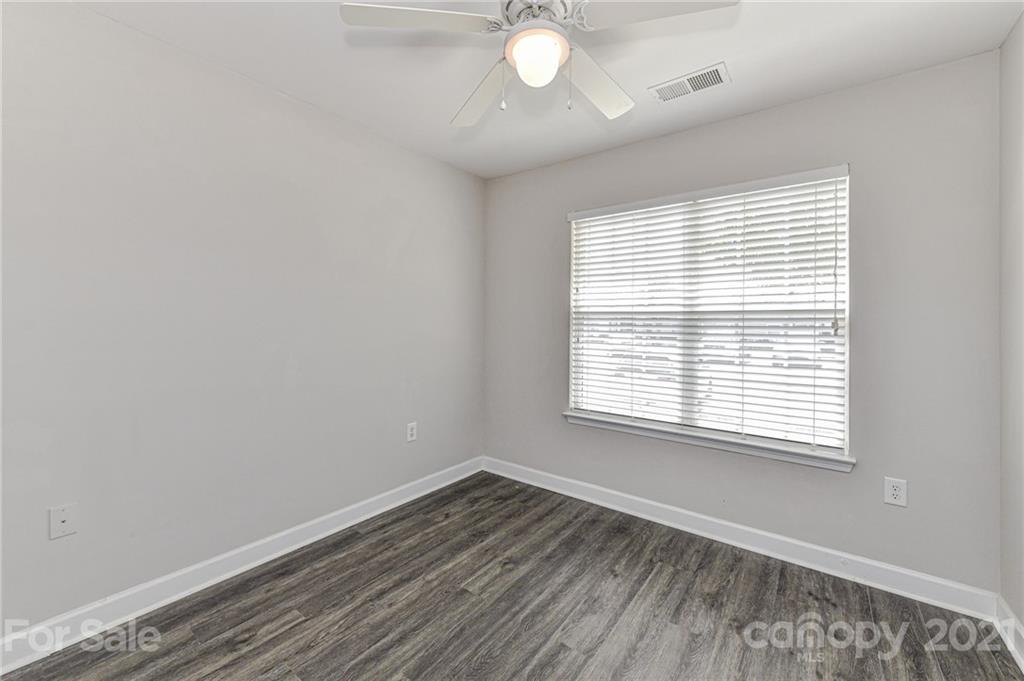 1894 Sandal Brook Road Indian Land, SC 29707 - Photo 22 of 30 a view of an empty room with wooden floor and a window