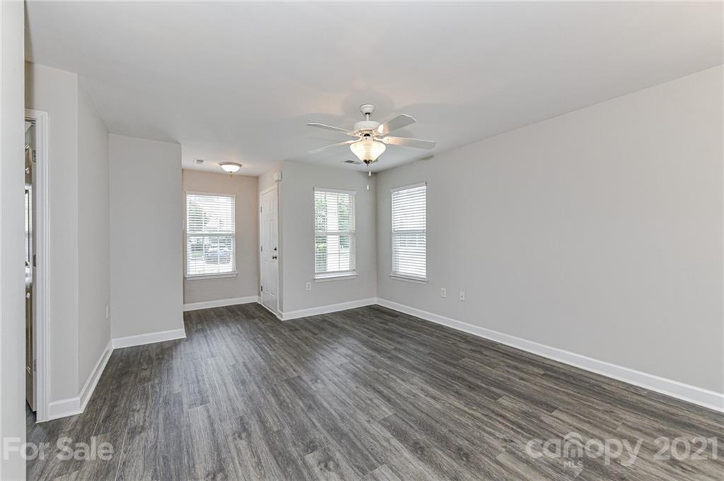 1894 Sandal Brook Road Indian Land, SC 29707 - Photo 6 of 30 a view of an empty room with a window and wooden floor