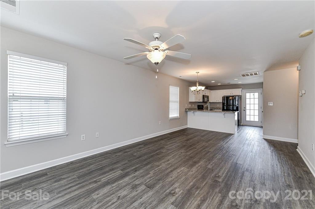 1894 Sandal Brook Road Indian Land, SC 29707 - Photo 7 of 30 a view of a kitchen with wooden floor and a ceiling fan