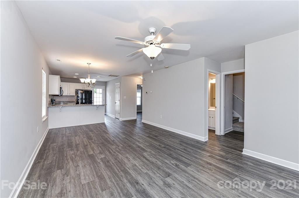 1894 Sandal Brook Road Indian Land, SC 29707 - Photo 8 of 30 a view of a kitchen with wooden floor and a ceiling fan