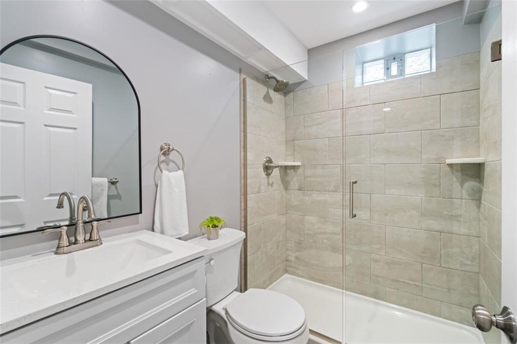 6649 Kinsman Road Pittsburgh, PA 15217 - Photo 31 of 37 New bathroom in the lower level game room area.