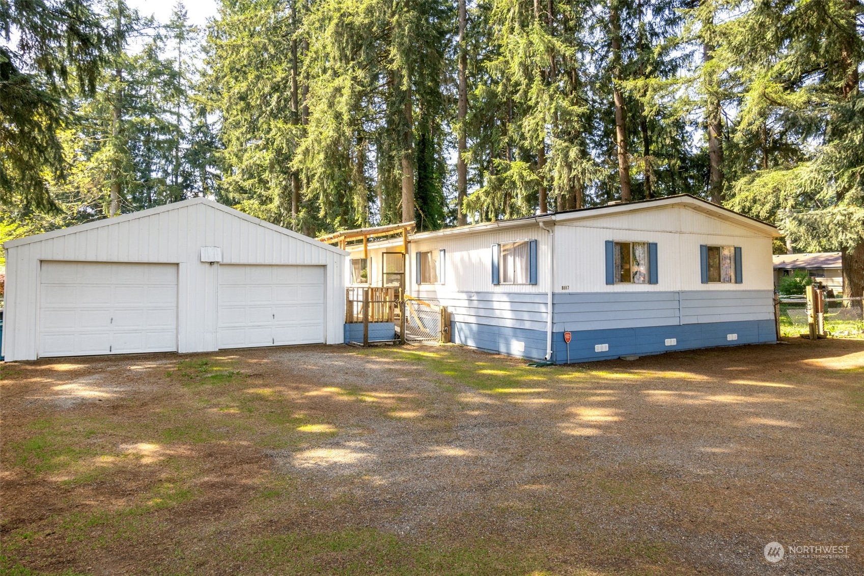 8117 176th Avenue Southwest Rochester, WA 98579 - Photo 1 of 27 a view of a house with a yard and garage