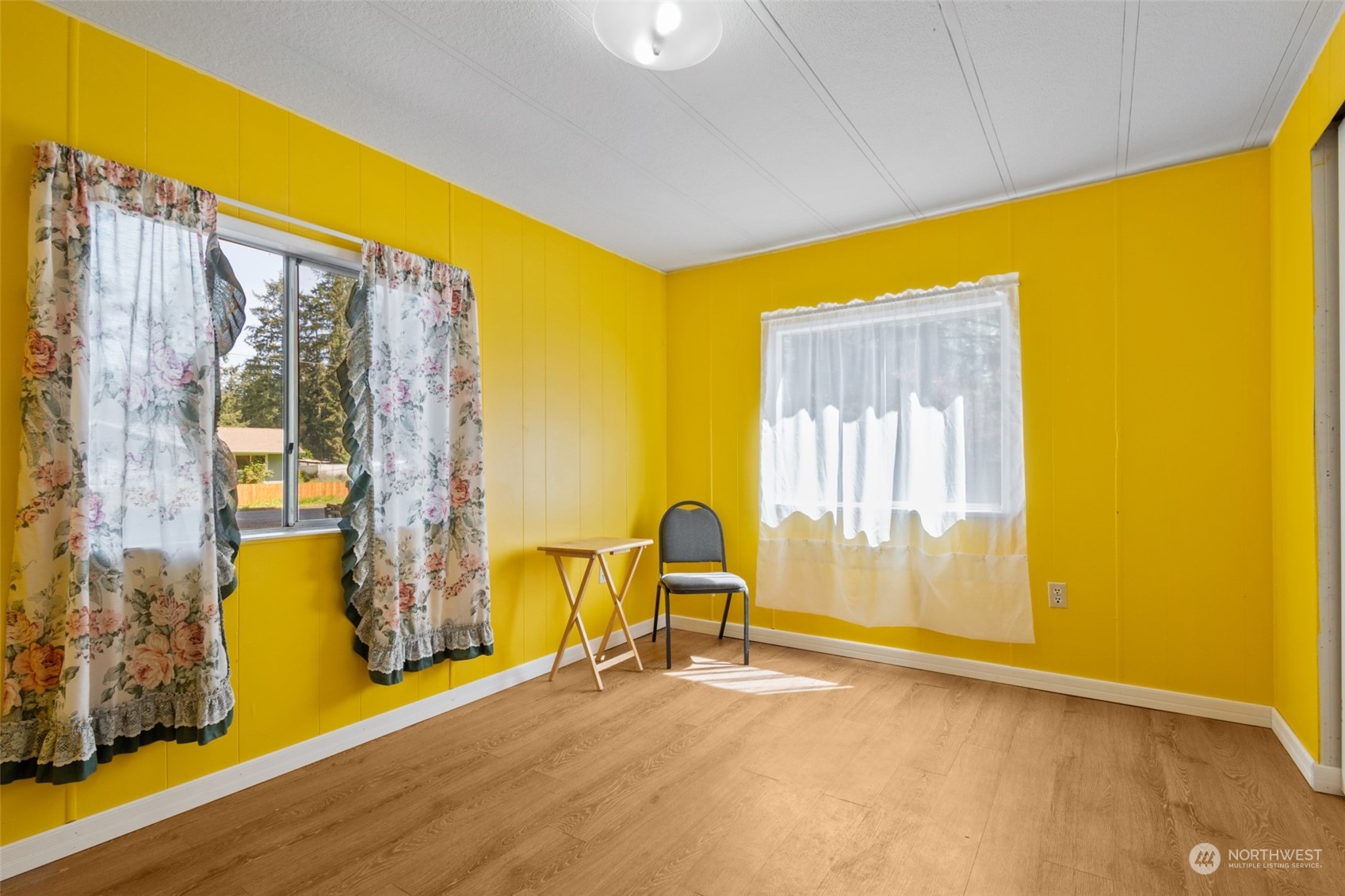 8117 176th Avenue Southwest Rochester, WA 98579 - Photo 19 of 27 a view of a room with wooden floor and door