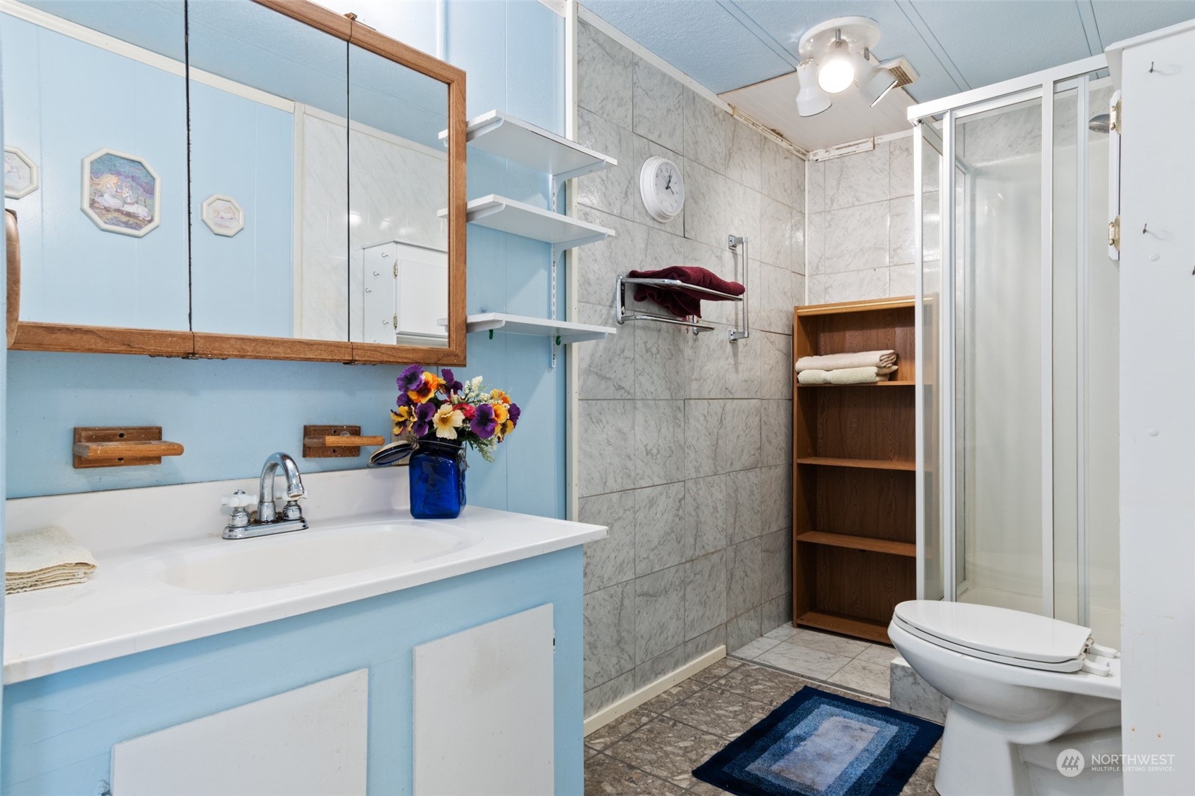 8117 176th Avenue Southwest Rochester, WA 98579 - Photo 20 of 27 a bathroom with a sink a toilet and shower