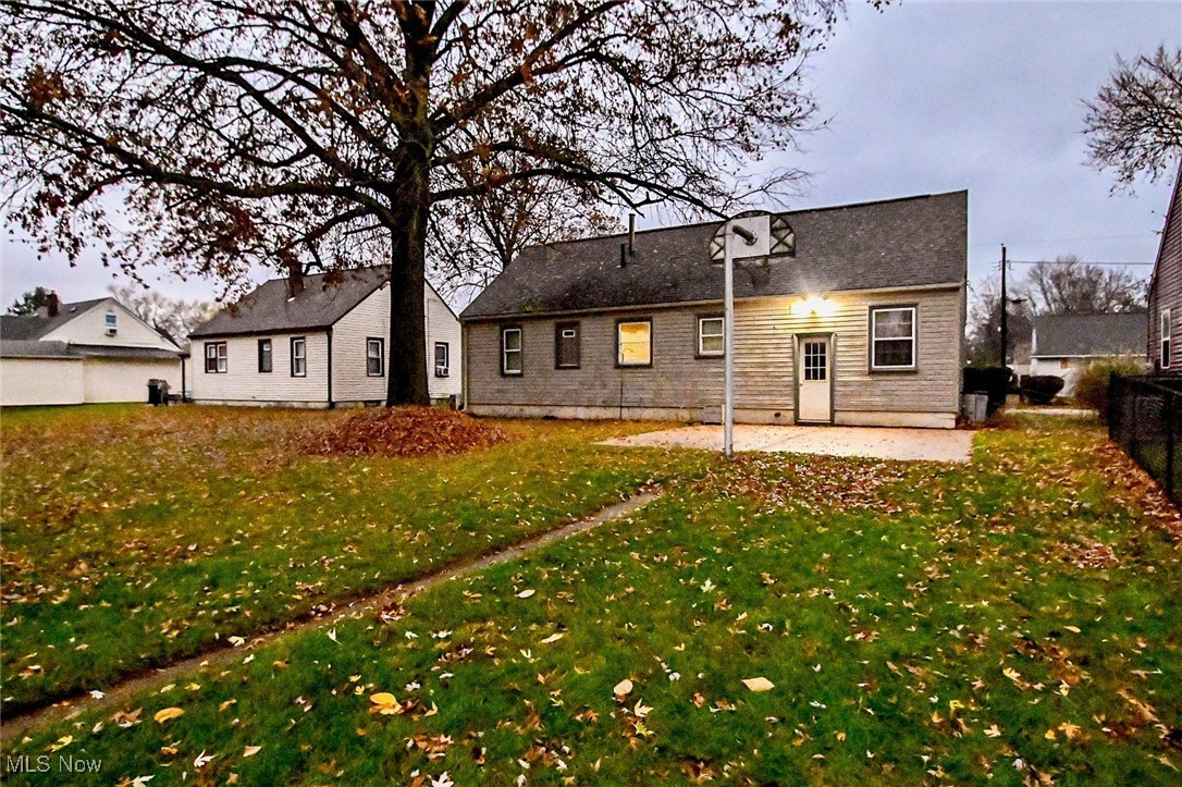 4858 Arbor Road Southwest Canton, OH 44710 - Photo 5 of 31 Rear view of property with a patio and a yard
