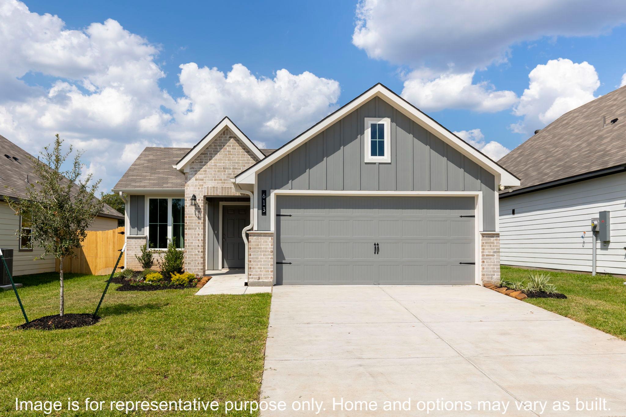228 Gus Loop Georgetown, TX 78626 - Photo 8 of 16 a front view of a house with a yard