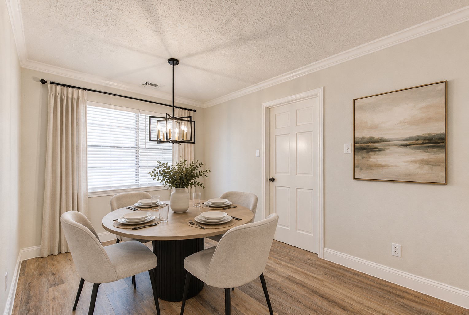 9115 Taidswood Drive Spring, TX 77379 - Photo 13 of 45 The breakfast area has new blinds, paint, crown molding, new chandelier, large format baseboards and new flooring!