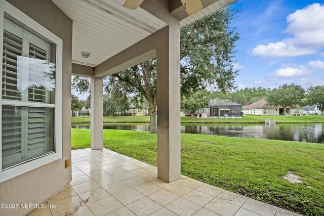 a front view of a house with a yard table and chairs