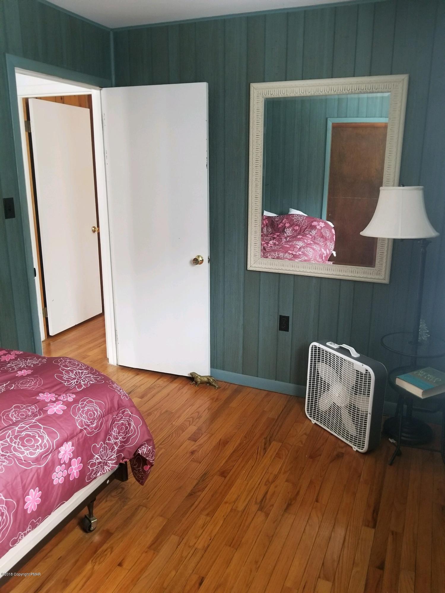195 Sage Road Long Pond, PA 18334 - Photo 7 of 11 a bedroom with a bed and a cabinets