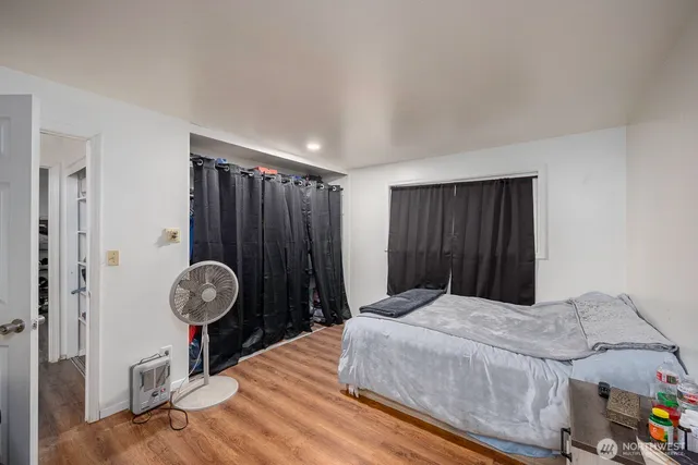 a bedroom with a bed and a closet in it