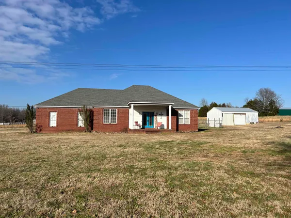 a front of a house with a yard