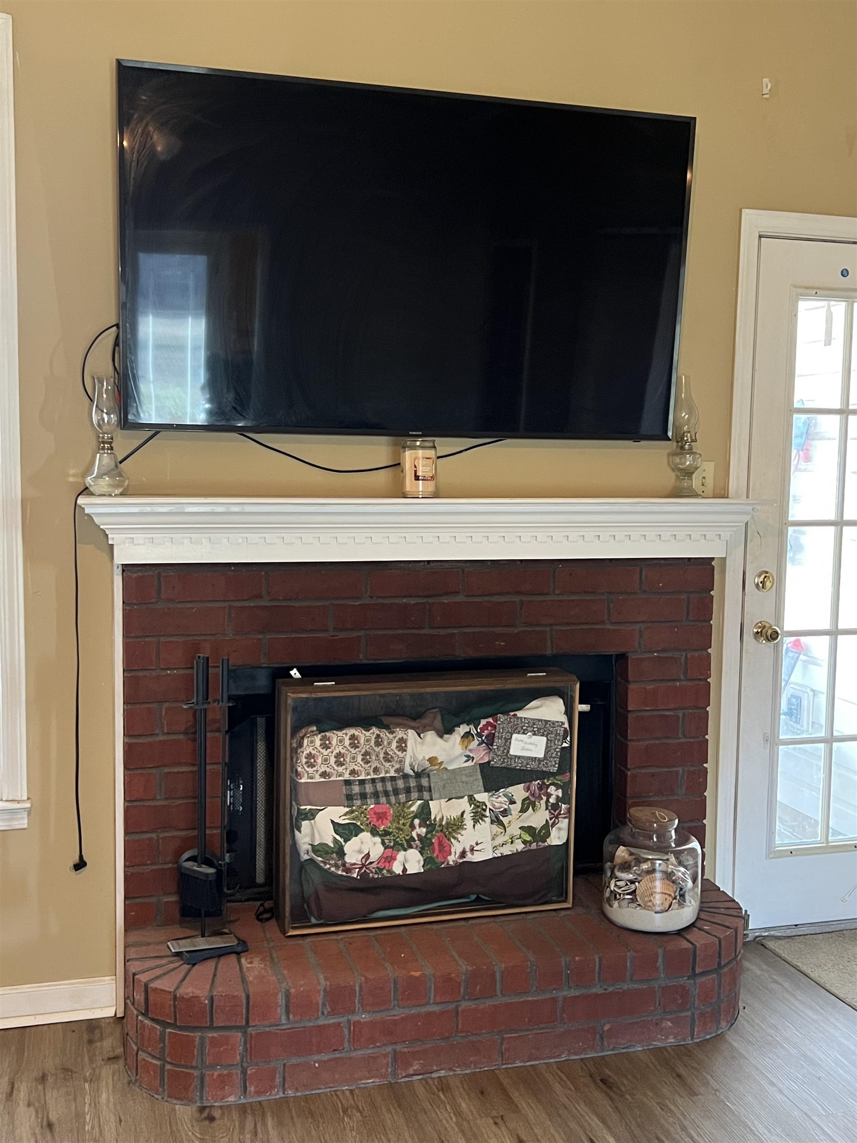 1990 Gainsville Road Mason, TN 38049 - Photo 4 of 13 Detailed view of a fireplace and wood finished floors