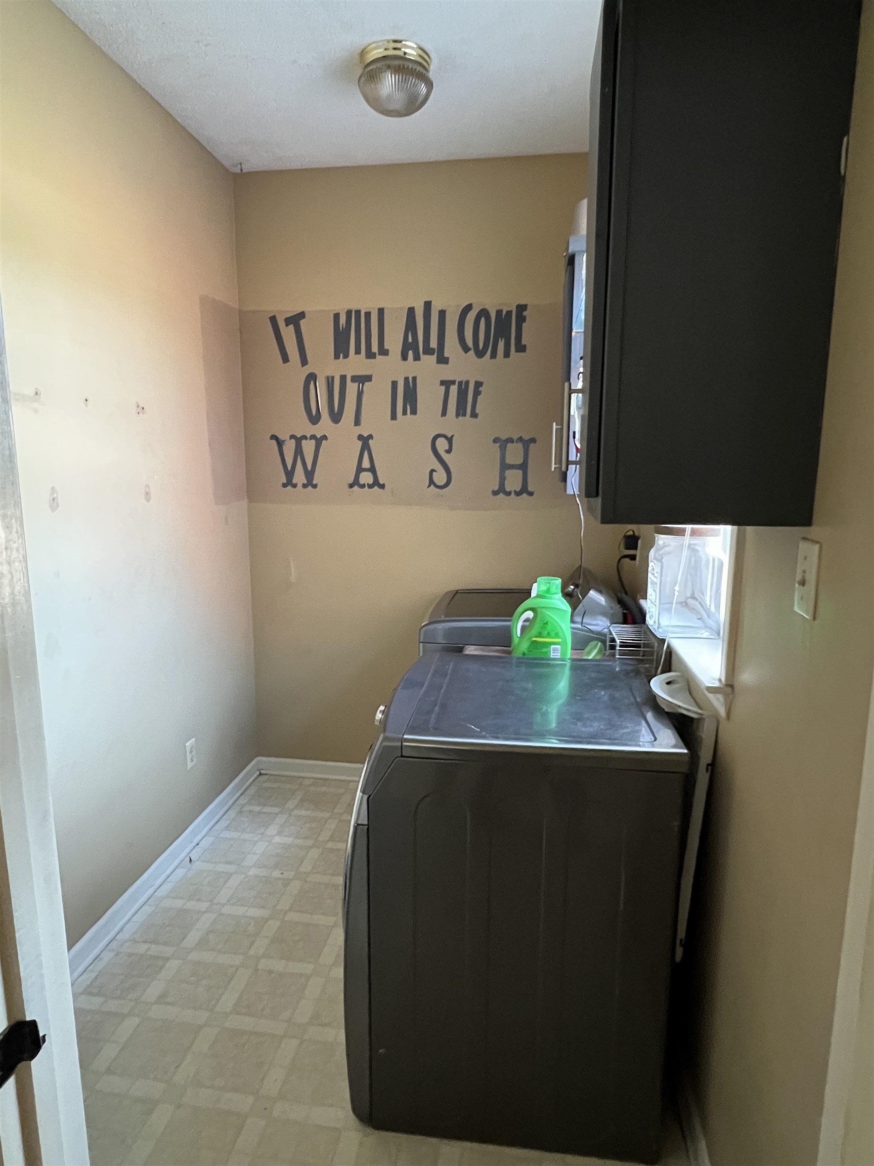 1990 Gainsville Road Mason, TN 38049 - Photo 7 of 13 Washroom featuring light flooring, washing machine and dryer, and cabinet space