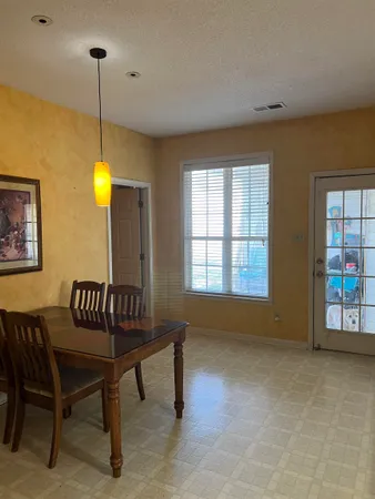a view of a livingroom with furniture and windows