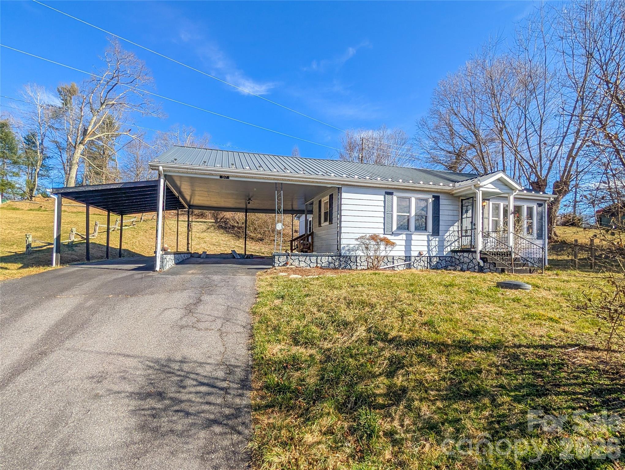 97 Tom Sparks Road Spruce Pine, NC 28777 - Photo 1 of 36 a view of a house with swimming pool