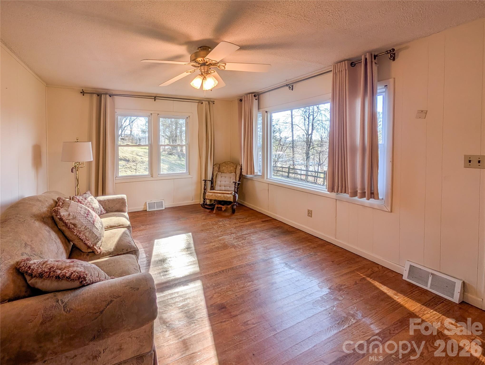 97 Tom Sparks Road Spruce Pine, NC 28777 - Photo 11 of 35 a living room with furniture and a large window