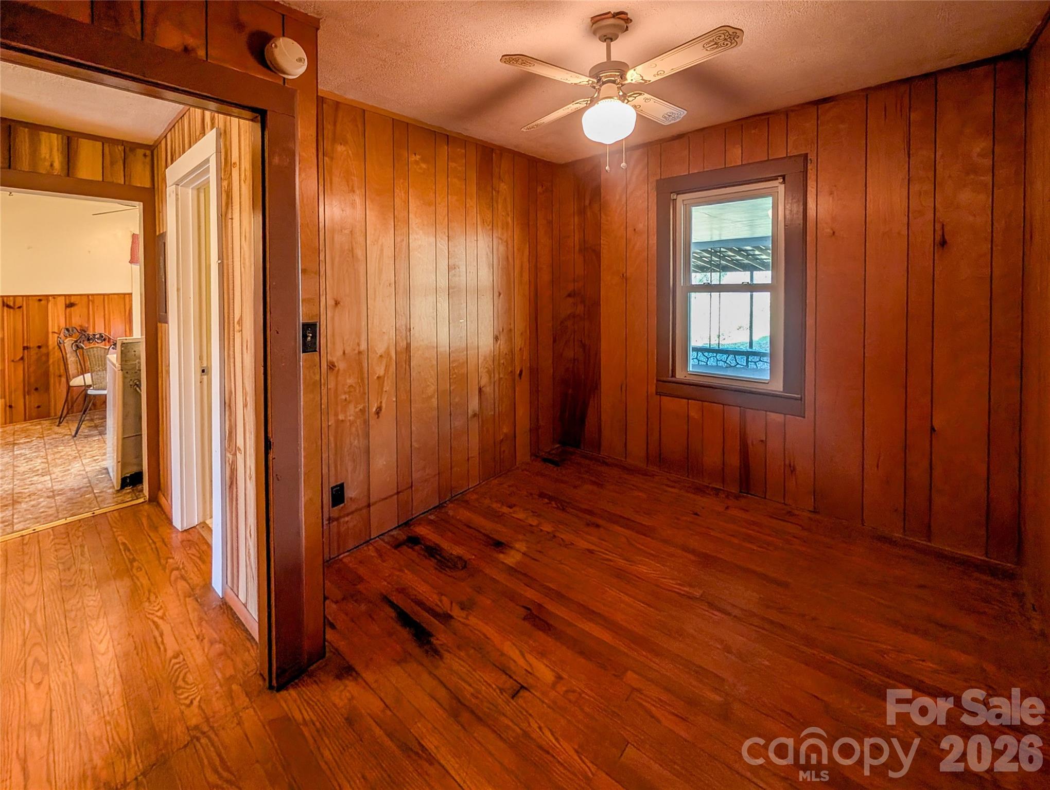 97 Tom Sparks Road Spruce Pine, NC 28777 - Photo 20 of 35 wooden floor in an empty room with a window
