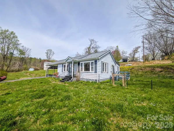 a view of a house with a big yard