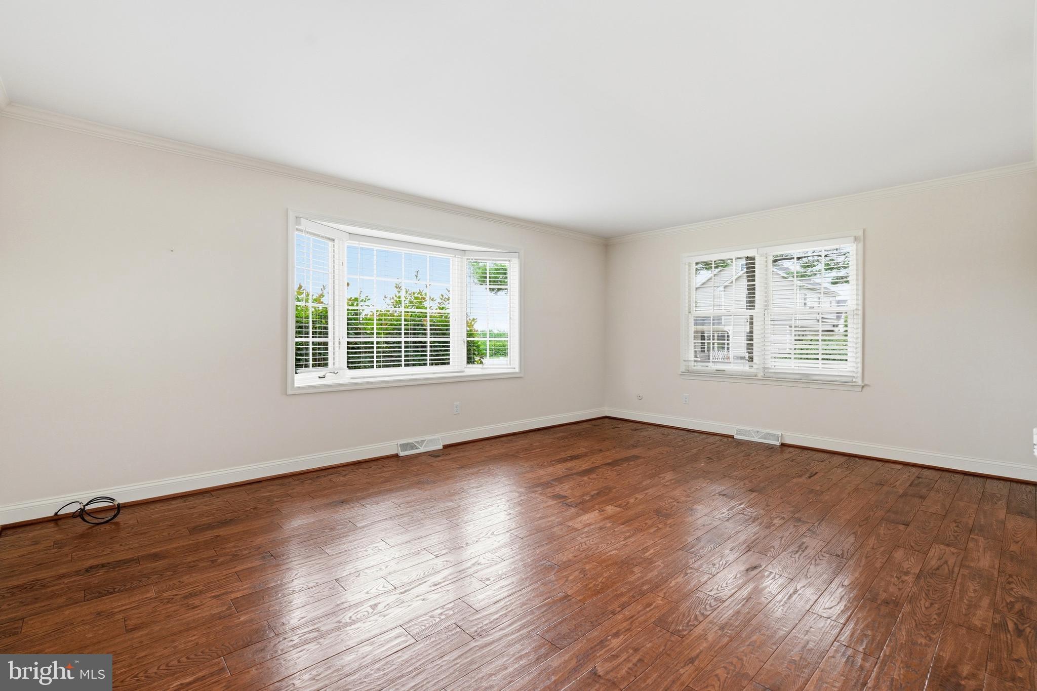 645 Mininger Road Souderton, PA 18964 - Photo 23 of 82 an empty room with wooden floor and windows