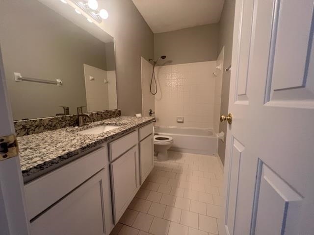 370 Lida Lane Memphis, TN 38018 - Photo 15 of 24 a bathroom with a granite countertop sink a mirror and a toilet