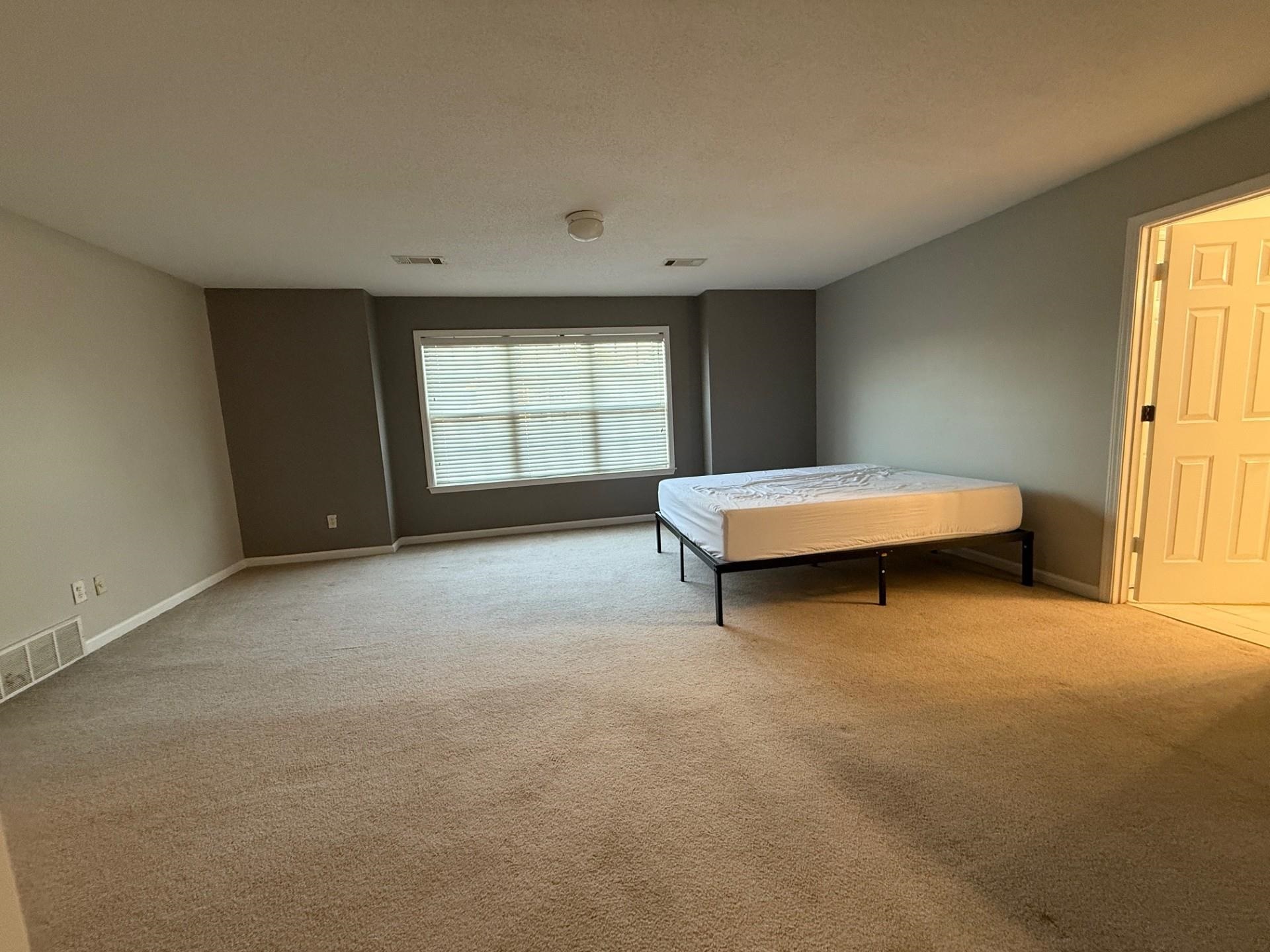 370 Lida Lane Memphis, TN 38018 - Photo 16 of 24 an empty room with a fireplace and large window
