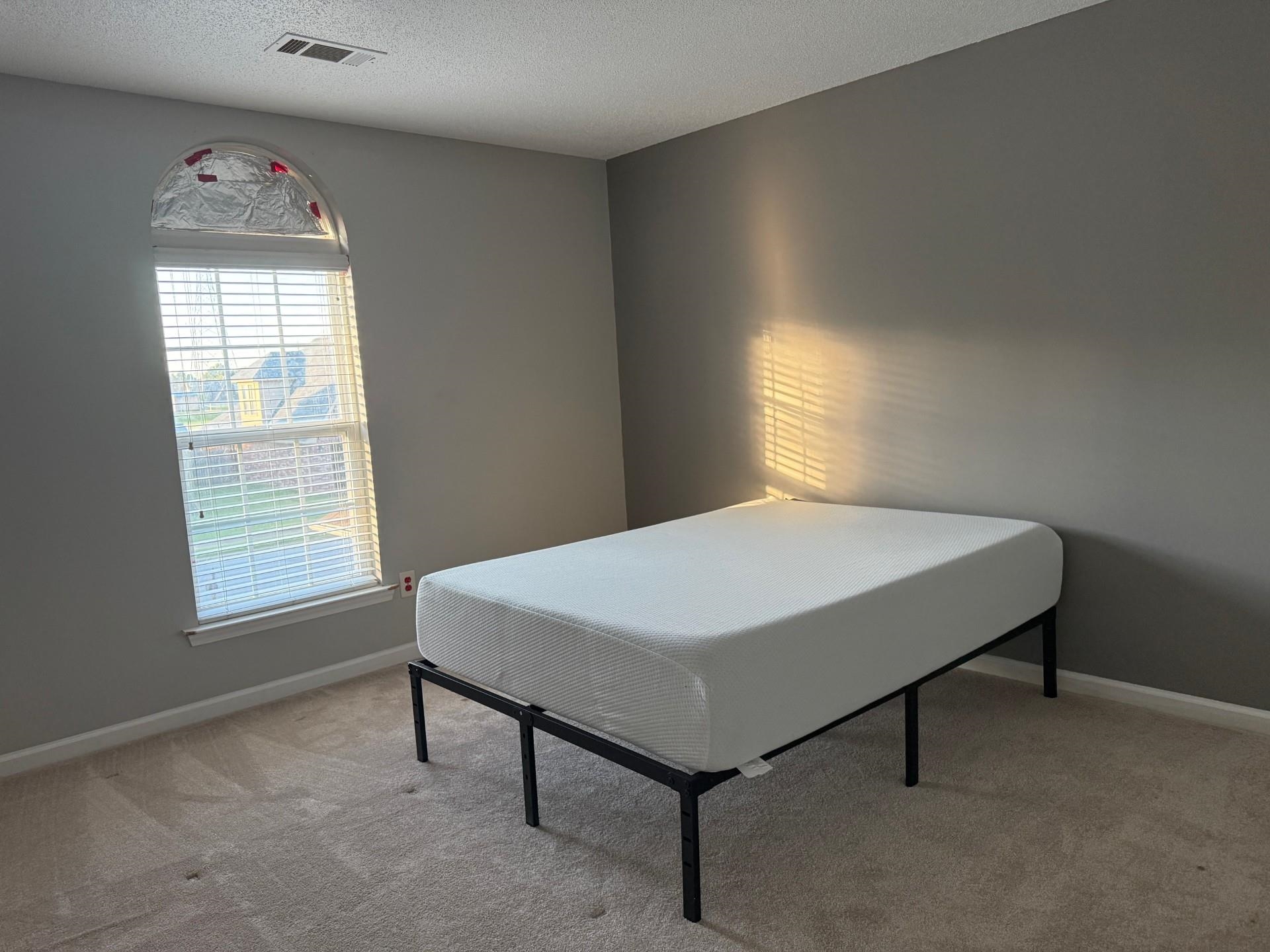 370 Lida Lane Memphis, TN 38018 - Photo 20 of 24 a bedroom with a bed and a window