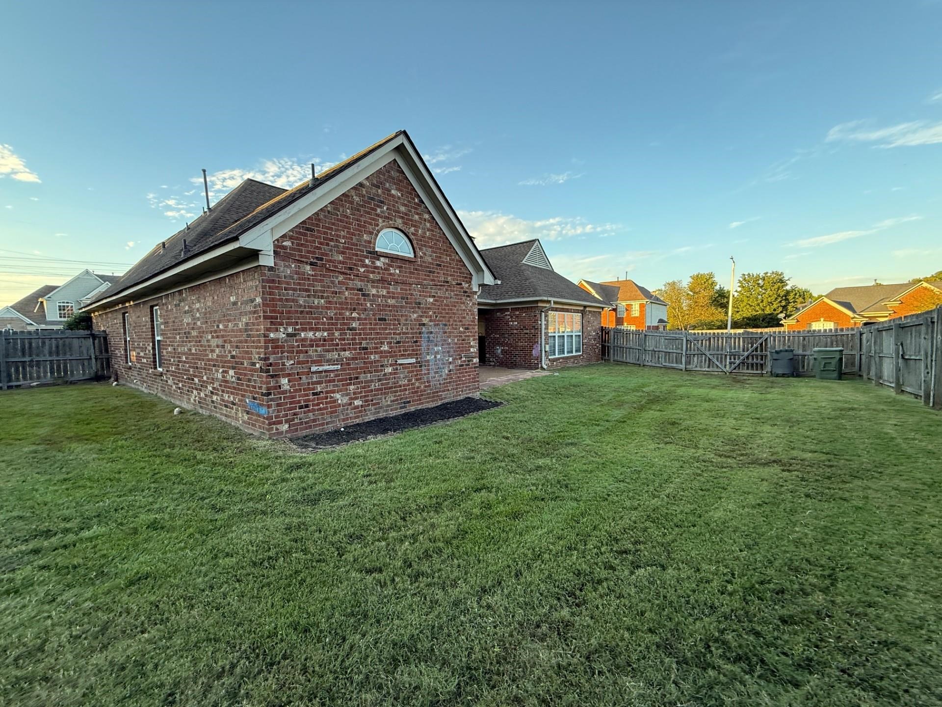 370 Lida Lane Memphis, TN 38018 - Photo 23 of 24 a view of a house with a yard