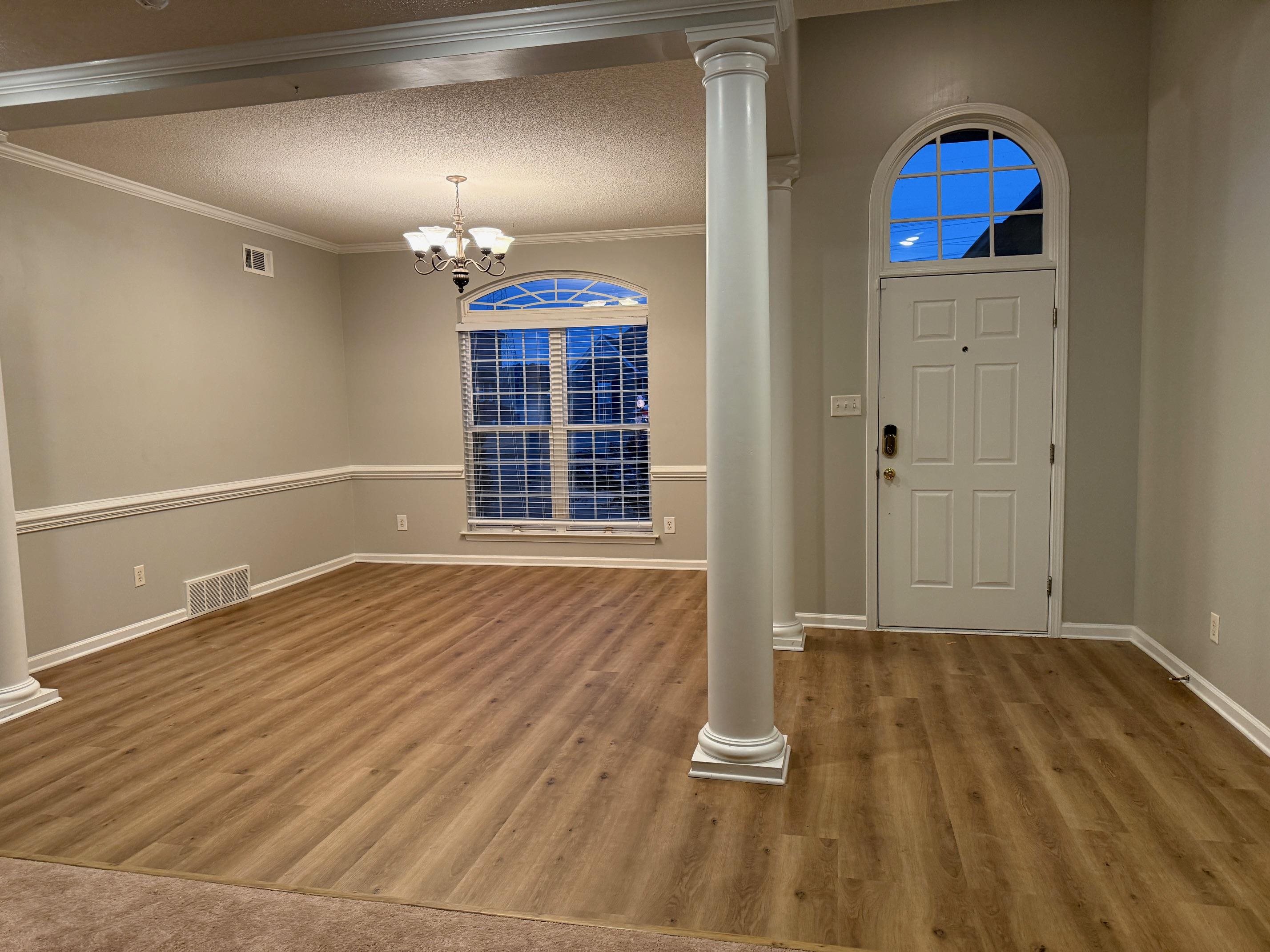 370 Lida Lane Memphis, TN 38018 - Photo 4 of 24 a view of empty room with wooden floor and window