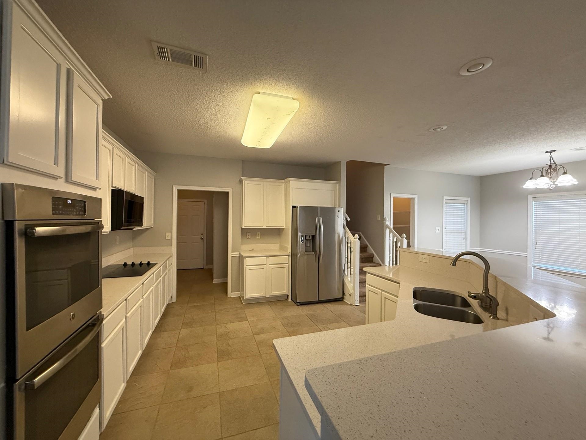 370 Lida Lane Memphis, TN 38018 - Photo 8 of 24 a kitchen with stainless steel appliances a refrigerator and a sink