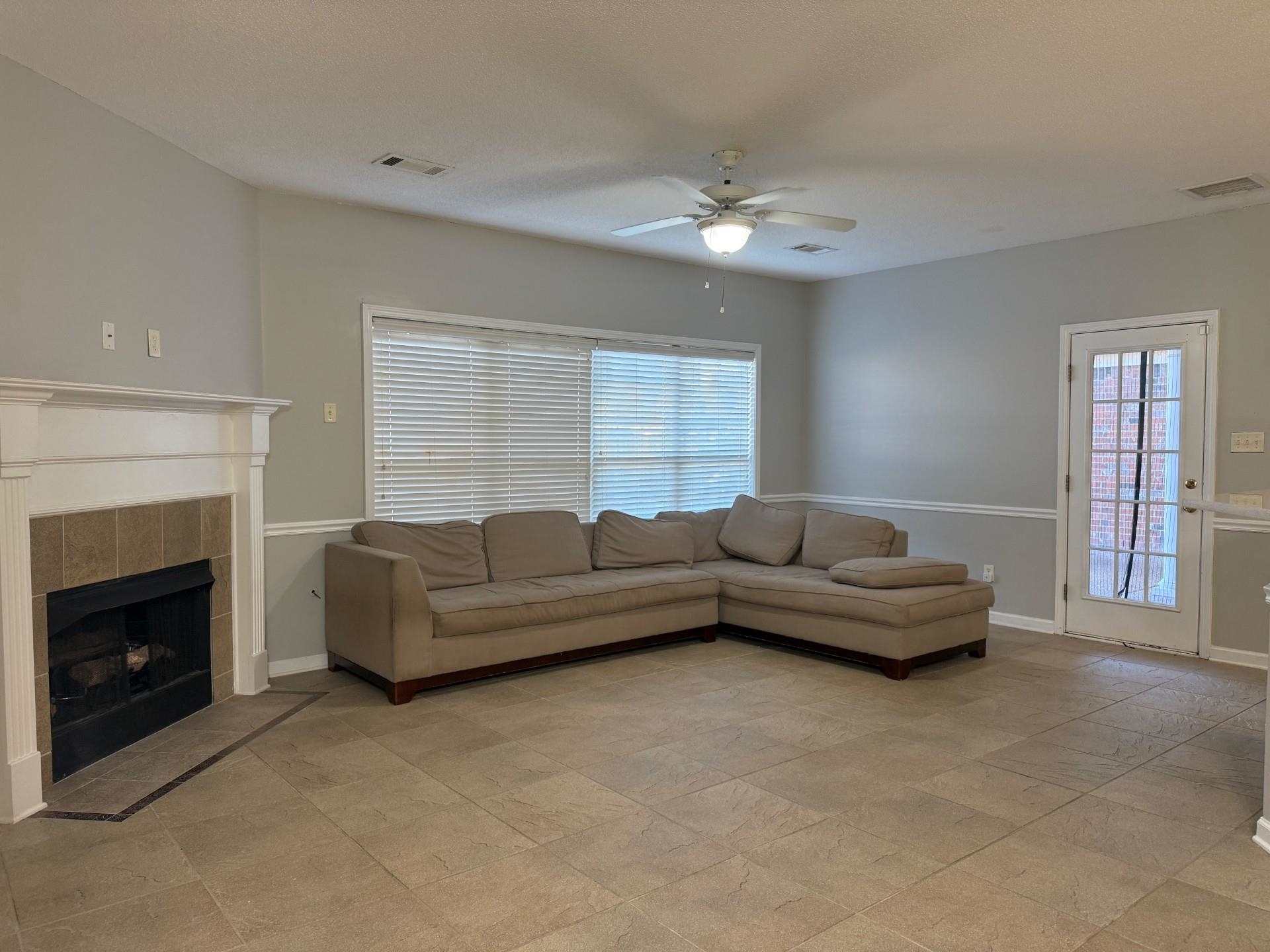 370 Lida Lane Memphis, TN 38018 - Photo 10 of 24 a living room with furniture and a fireplace