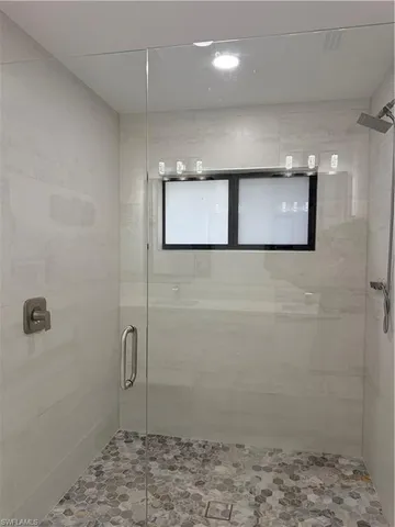 a front view of house with a garden