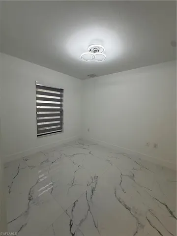 a kitchen with stainless steel appliances a refrigerator sink and microwave