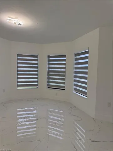 a bathroom with a double vanity sink a toilet and a bathtub