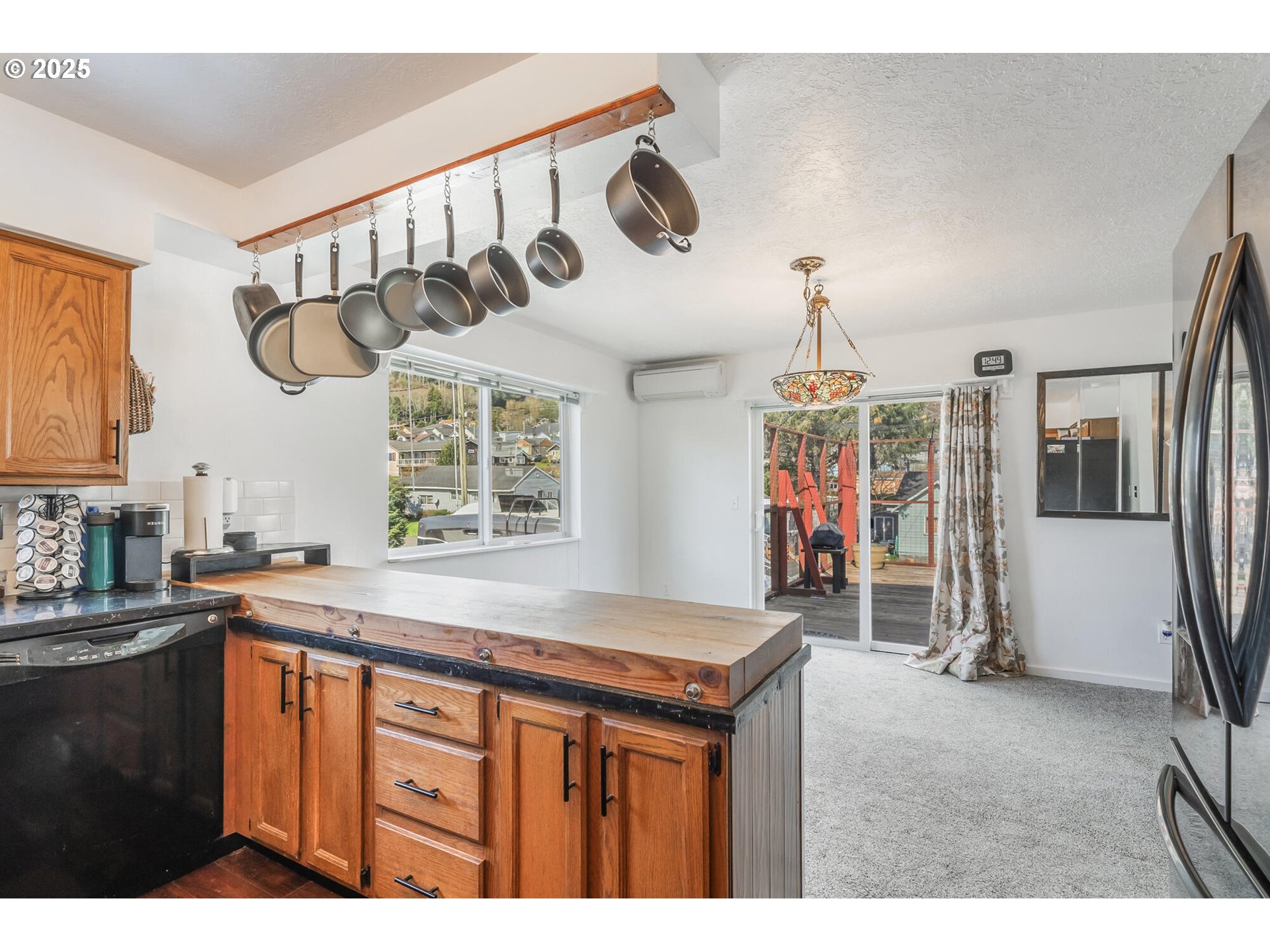 109 4th Street Garibaldi, OR 97118 - Photo 12 of 48 a kitchen that has a lot of cabinets in it