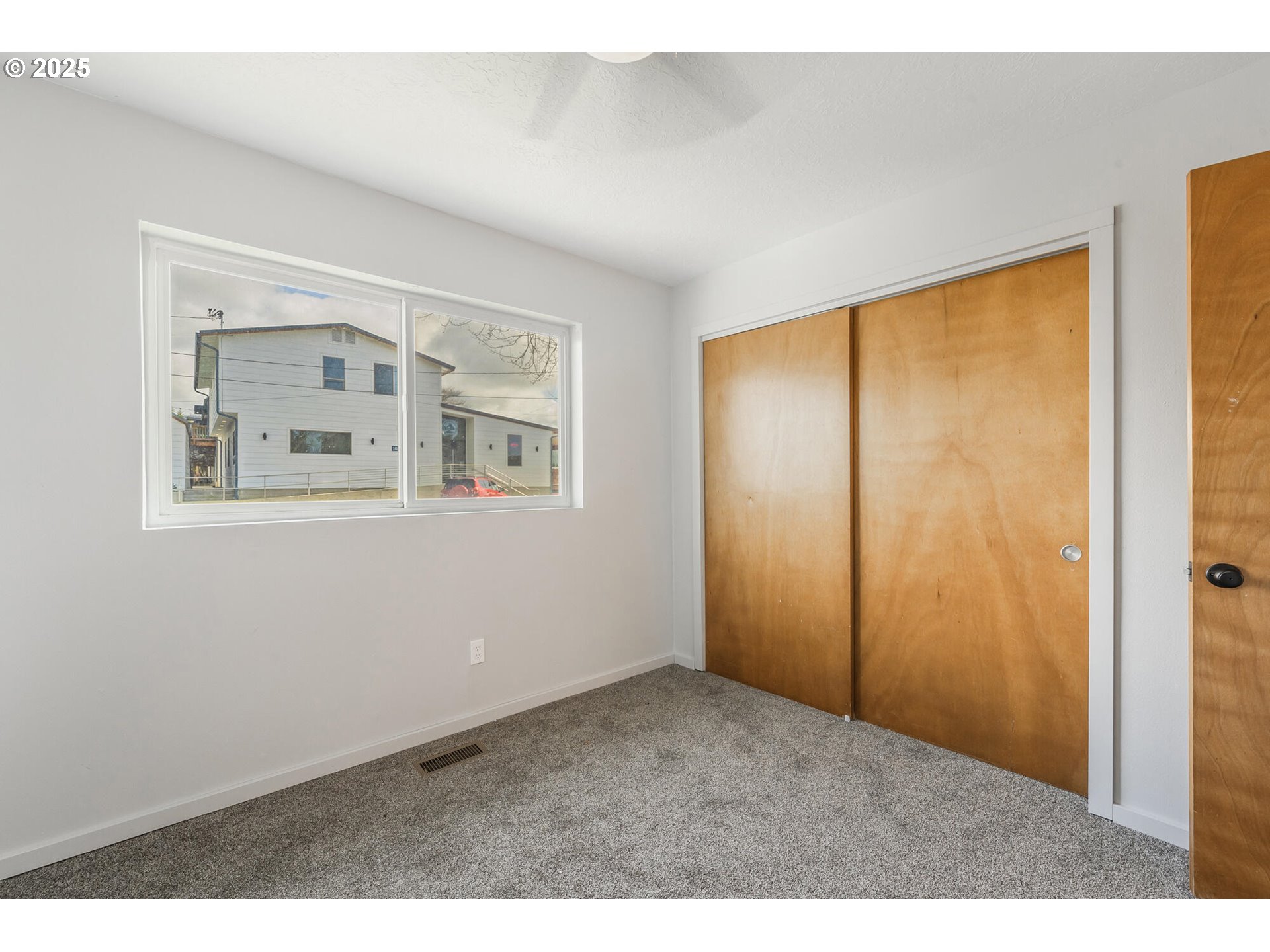 109 4th Street Garibaldi, OR 97118 - Photo 20 of 48 a view of an empty room with a window