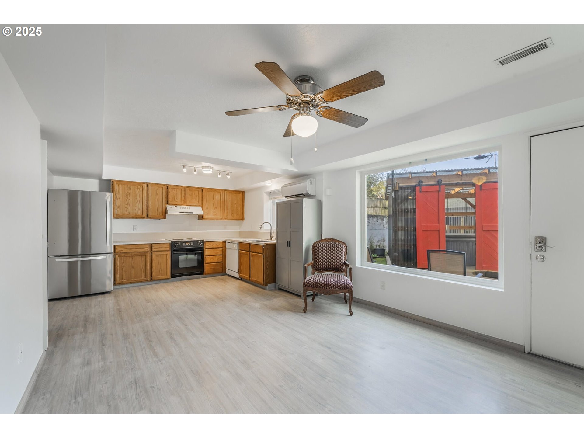 109 4th Street Garibaldi, OR 97118 - Photo 26 of 48 a living room with furniture and a window