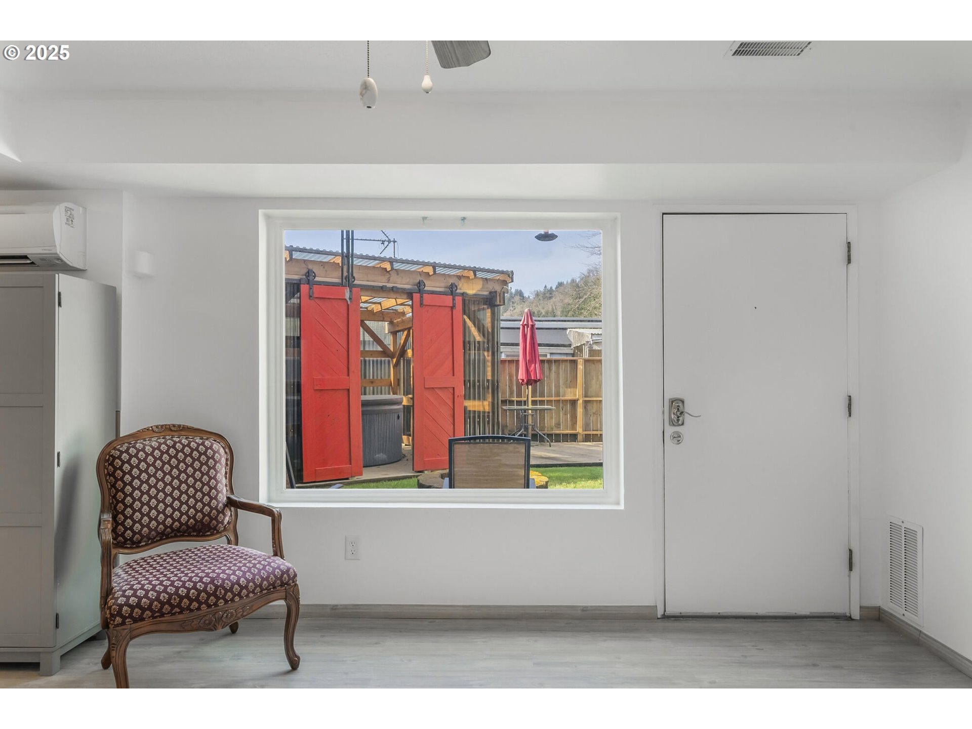 109 4th Street Garibaldi, OR 97118 - Photo 34 of 48 a living room with furniture and a window